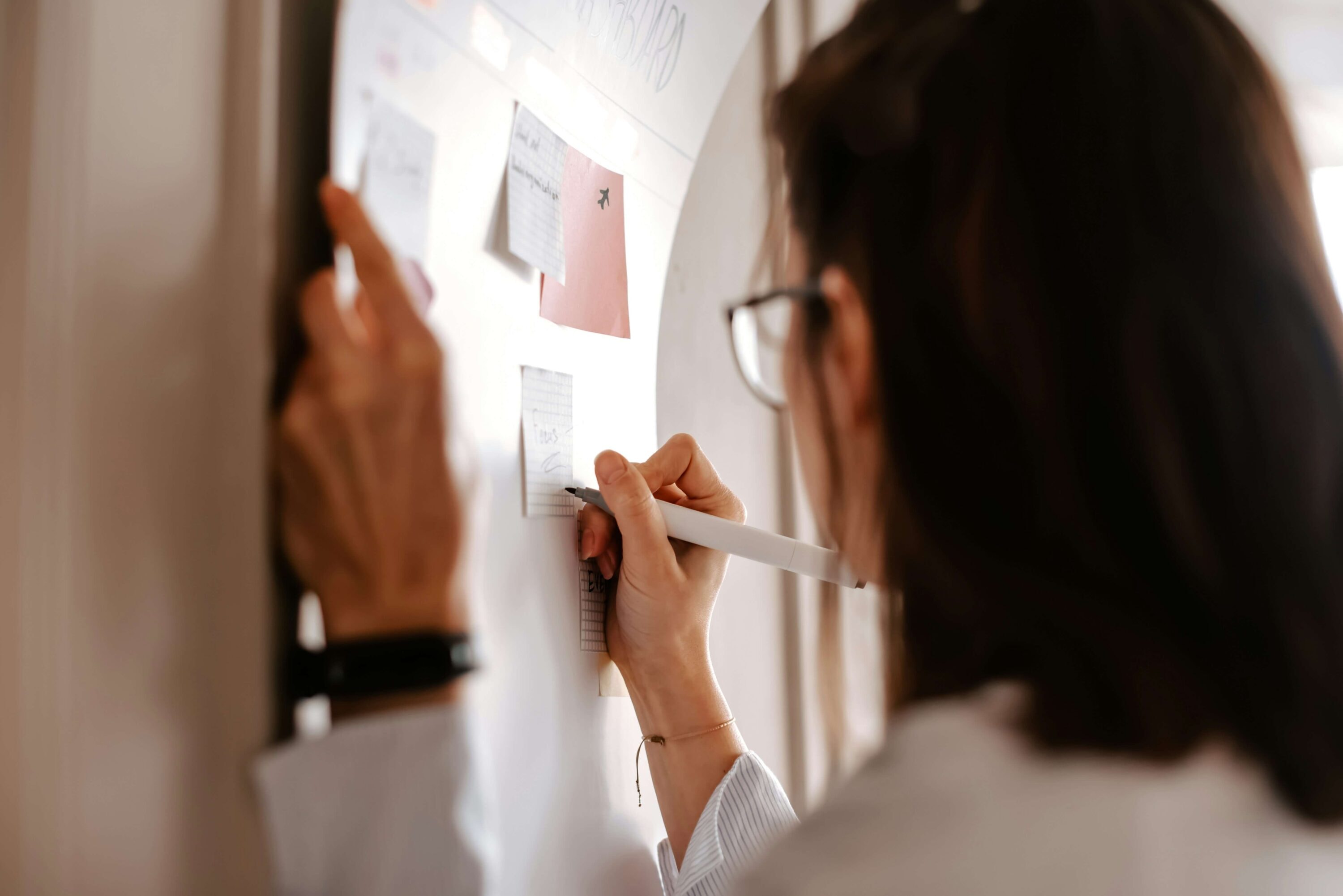 Woman writing on a board during workshop